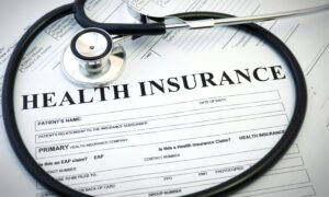 Health insurance form with stethoscope