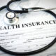 Health insurance form with stethoscope